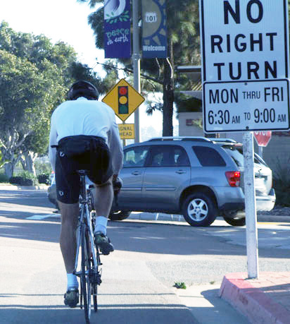 bicyclists riding in bike lane in Solana Beach in front of attorney Dean Goetz's law office
